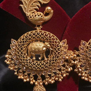 TANISHQ Designer Elephant (Hati) / Peacock Antique Gold Earrings - Golden Treasure